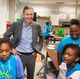 GEA CEO Kevin Nolan with JCPS Backpack League
