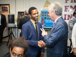 Louisville Mayor Greg Fischer greets student leader Ghadi Nshimiyimani at the launch of the Doss High School mock assembly line Louisville Mayor Greg Fischer greets student leader Ghadi Nshimiyimani at the launch of the Doss High School mock assembly line