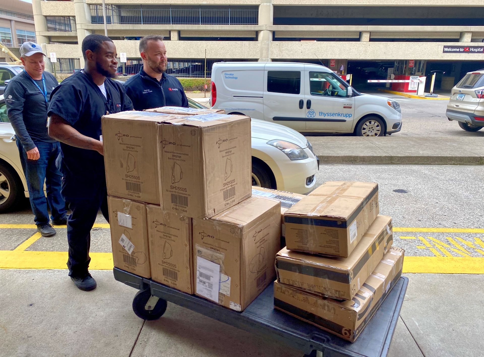 University of Louisville Health team unloads a donation of 2500 N95 masks from GE Appliances