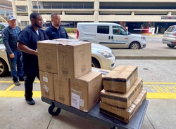 University of Louisville Health team unloads a donation of 2500 N95 masks from GE Appliances