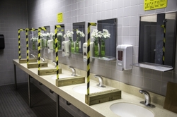 Solid Lexan barriers separate the sinks in the women’s restrooms.