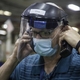 A Maintenance Business Leader wears his required mask and face shield.