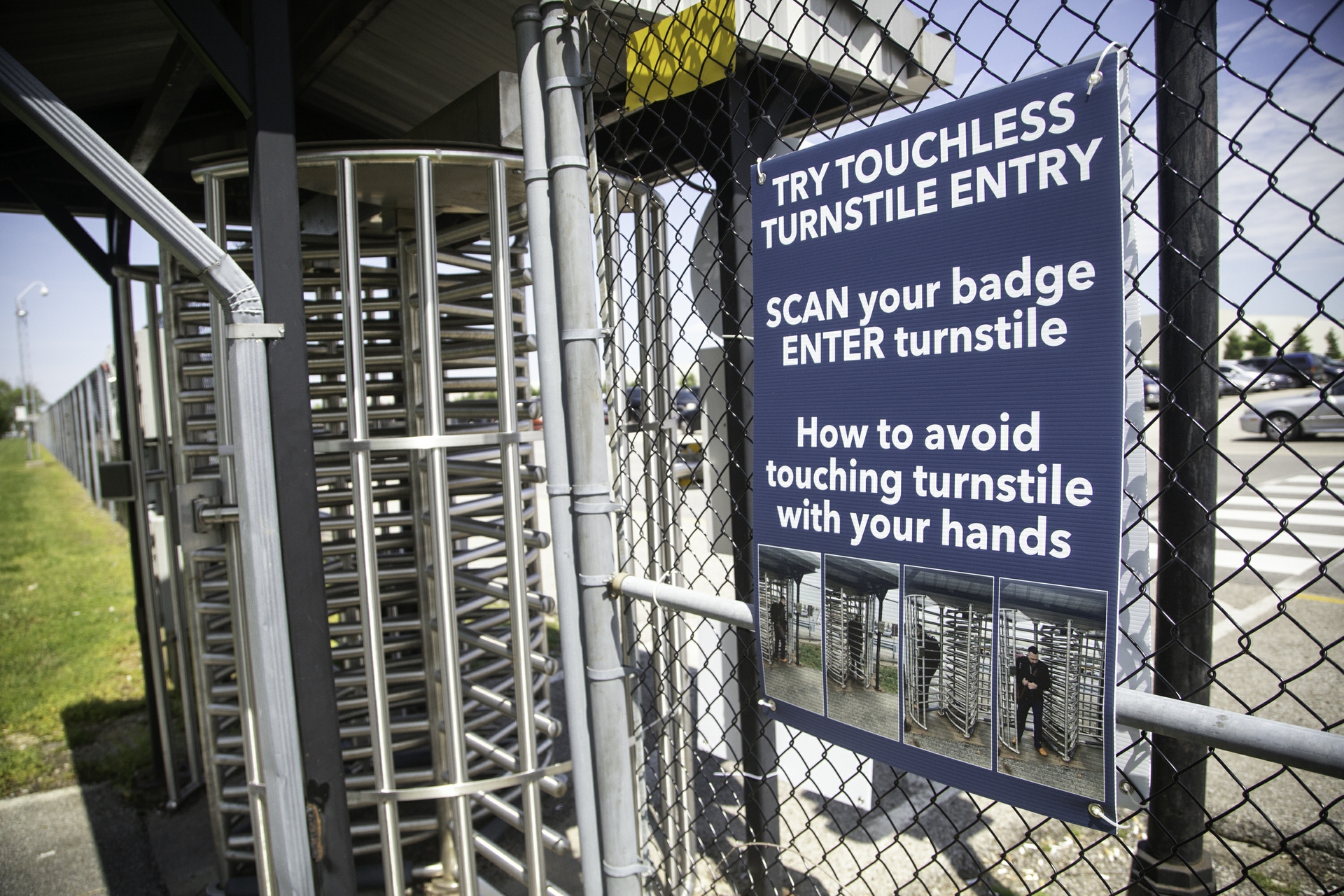 Instructional signage is posted at entrances on touchless turnstile entry.