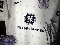 Close-Up of Racing Louisville FC Away Kit with GEA Logo Close-Up of Racing Louisville FC Away Kit with GEA Logo