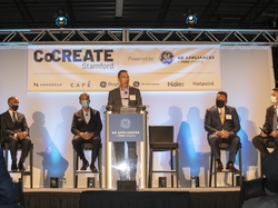 GEA CEO Kevin Nolan speaks from podium 2