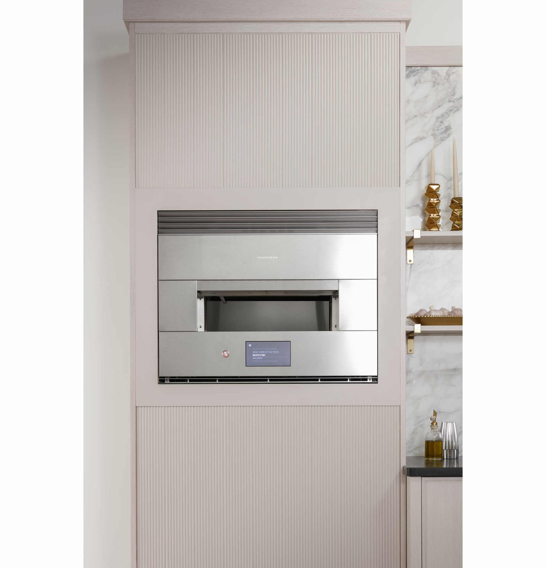 Monogram Smart Flush Hearth Oven features a 7 LCD touchscreen that shows preset cooking options for a variety of foods offering an ease-of-use that allows anyone to make delicious results