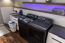 The GE Profile 900 Series Top Load Washer has SmartDispense Technology automatically adjusts the amount of detergent dispensed and Microban antimicrobial technology.