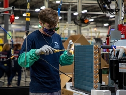 An operator on the production line for the Zoneline Ultimate V10 VTAC_Selmer TN