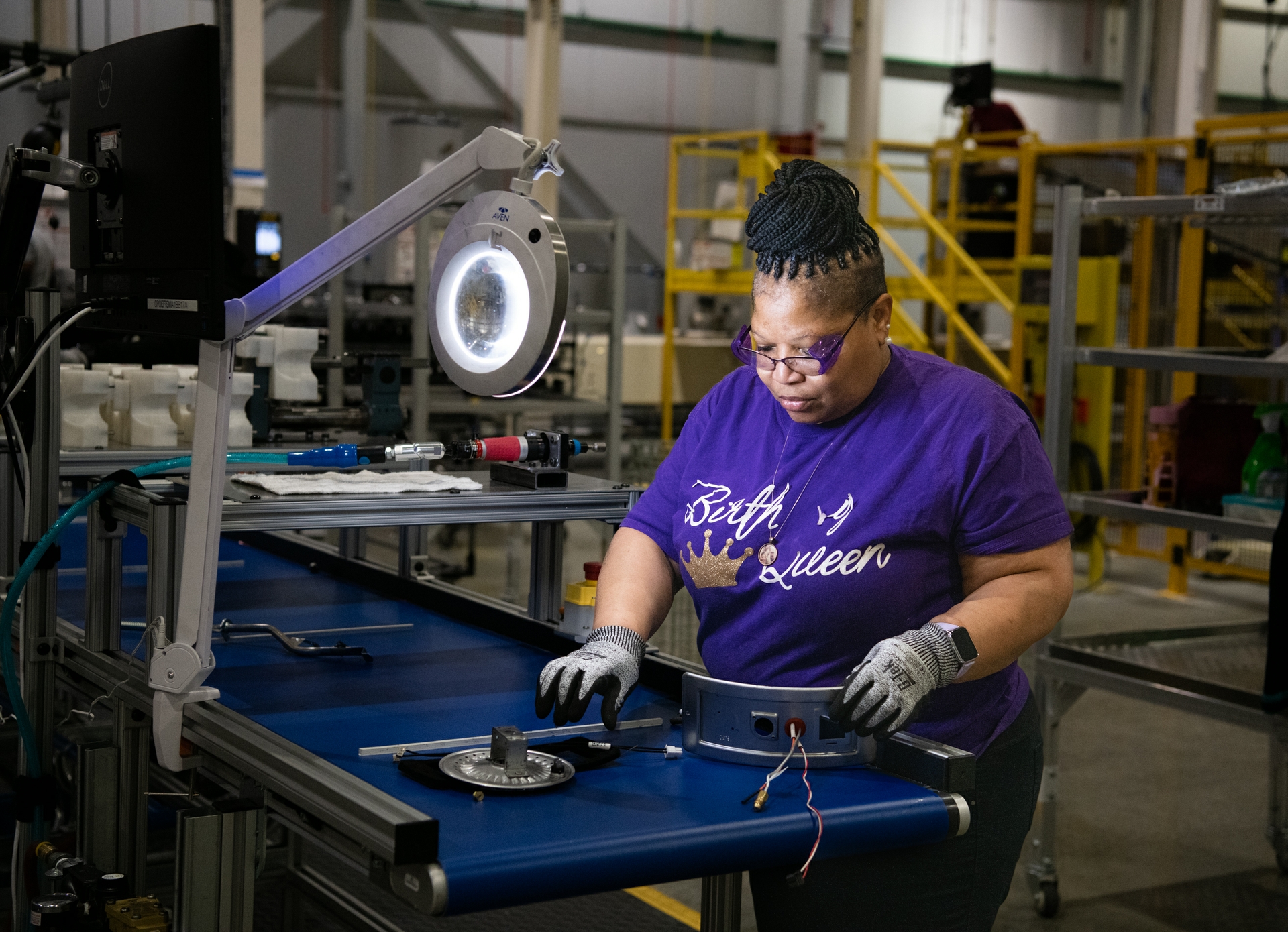 Operator Kim Fleming builds a burner assembly for the new water heaters being made by GE Appliances in Camden South Carolina.