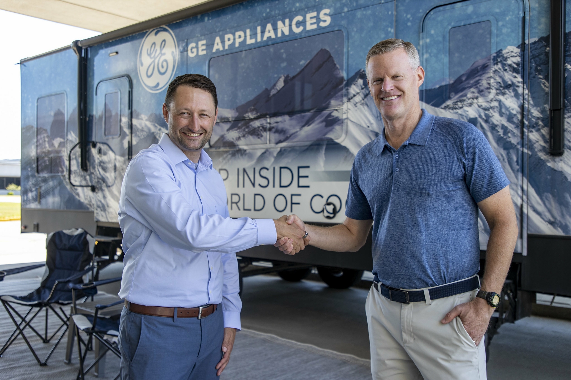 CEO of Midwest Sales and Services Inc. Heath Wechter shakes hands with CCO of GE Appliances Rick Hasselbeck as the two companies make the announcement.