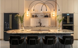New CAFÉ Brushed Brass Hardware on Matte Black Appliances