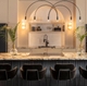 New CAFÉ Brushed Brass Hardware on Matte Black Appliances