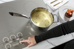 Glide Touch Controls gives owners full control through effortless touch on new Monogram induction cooktop. 