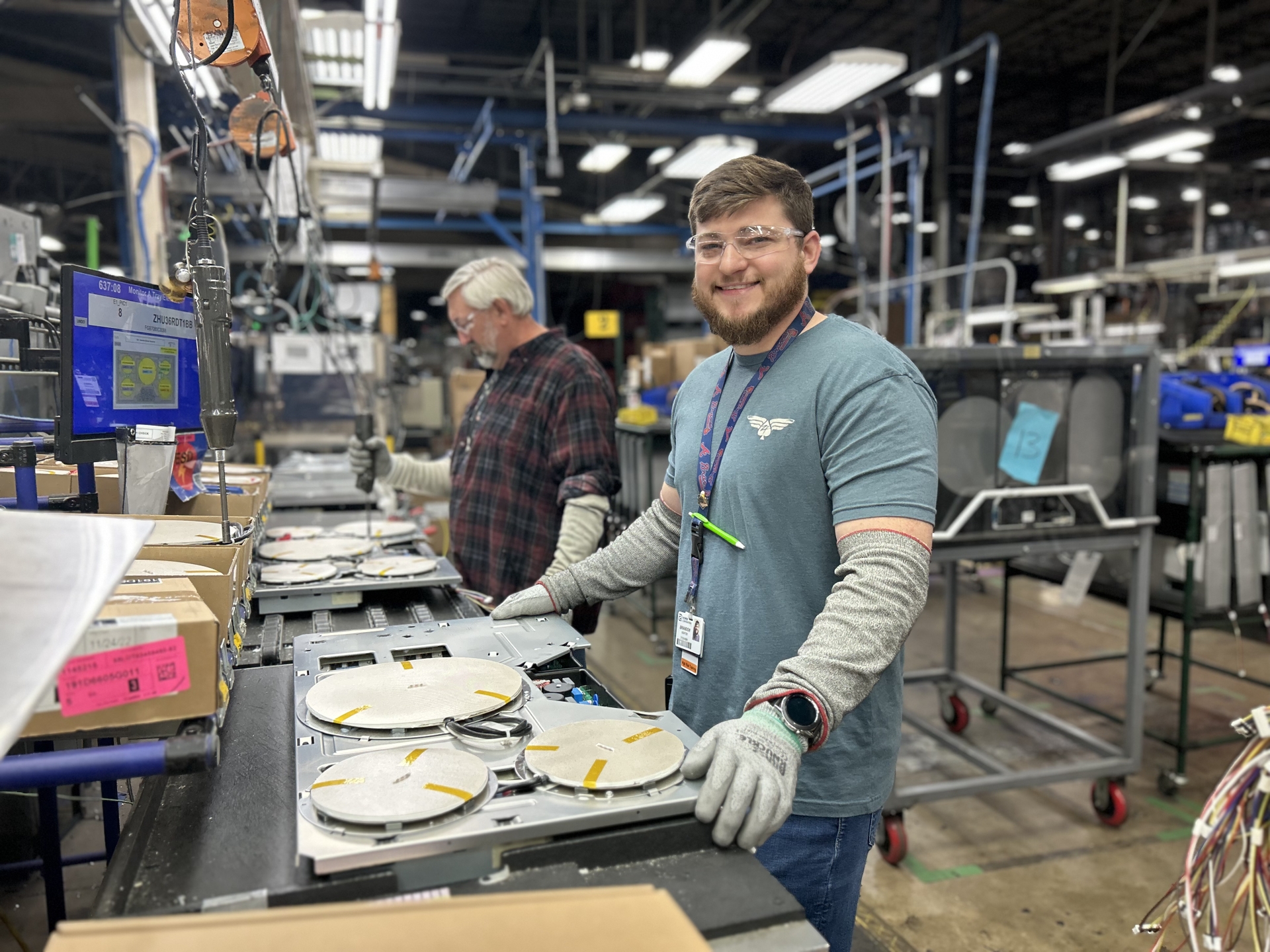 Brandon Hunter, Team Leader at Roper Corporation in LaFayette, GA with James Cochran in the background