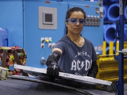 Habiba Sakhizada, a refugee from Afghanistan, was hired as part of the GEA Every Voice Program and builds washers and dryers in AP1