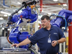 New robotics will perform various tasks on the assembly line from programming control boards to rotating units to allow operators easier access during assembly New robotics will perform various tasks on the assembly line from programming control boards to rotating units to allow operators easier access during assembly