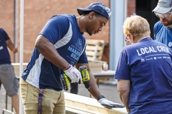 GE Appliances Employees Participate in a Build-a-Bed Volunteer Project. 