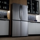 GE Profile 28 Cu. Ft. Smart Fingerprint Resistant Quad-Door Refrigerator with Dual-Dispense AutoFill Pitcher Outside