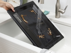 Pop Out the Enameled EasyWash Tray from the Bottom of the Oven and Rinse It Off in the Sink
