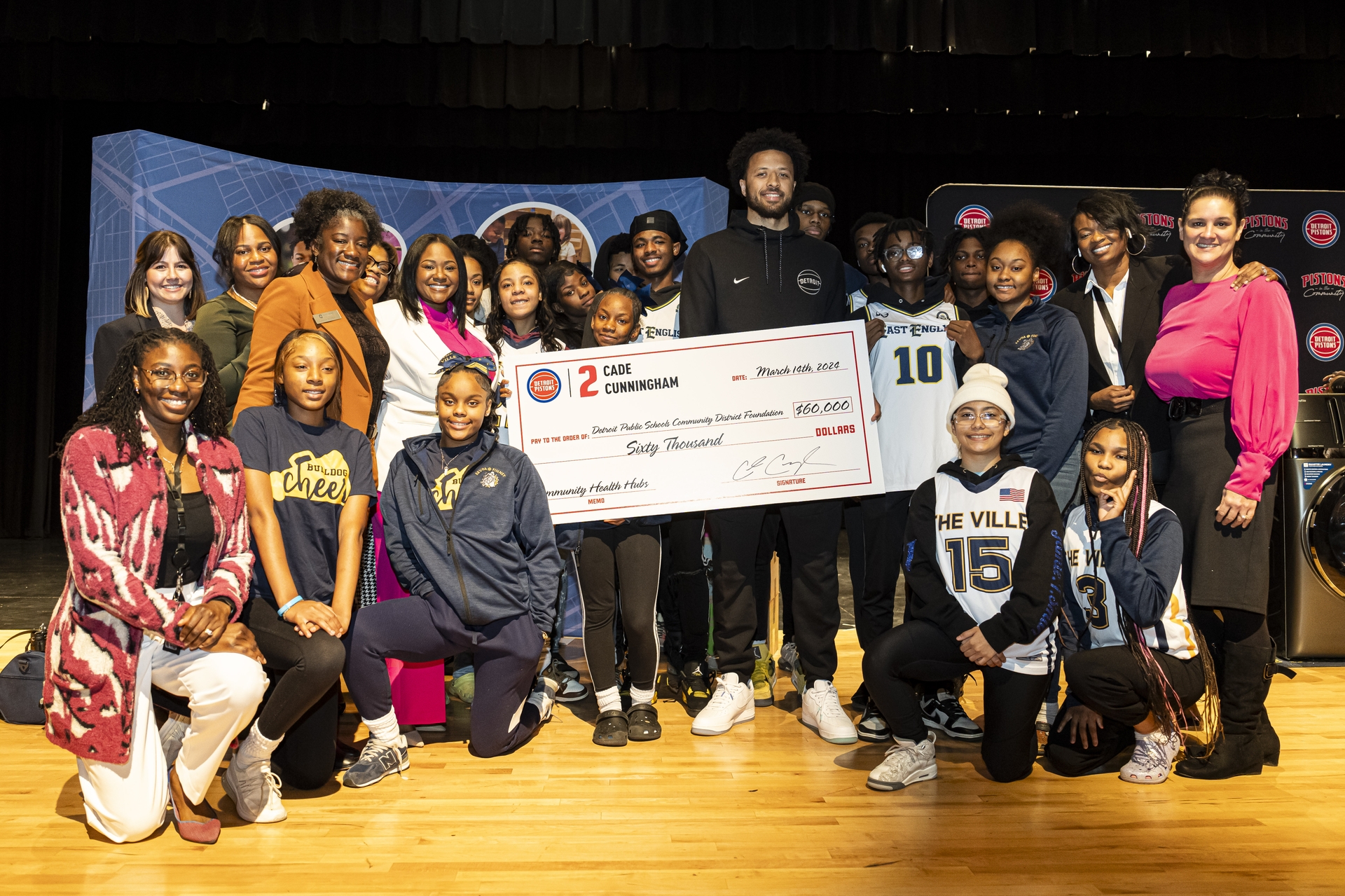 Students of Detroit's East English Village Preparatory Academy at Finney with Detroit Pistons Guard Cade Cunningham and representatives of GE Appliances and the Detroit Public Schools Community  District
