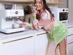 Ashley Park in her Matte White kitchen featuring the CAFÉ Bellissimo Semi Automatic Espresso Machine