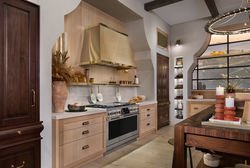 Monogram Designer Collection Features the 48 Dual Fuel Professional Range and Matching Hood in Brass