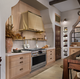 Monogram Designer Collection Features the 48" Dual Fuel Professional Range and Matching Hood in Brass