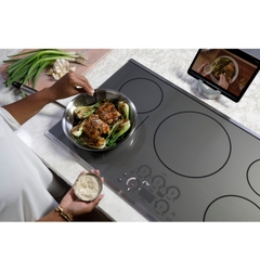 CAFÉ 36” Built-In Touch Control Induction Cooktop matches both aesthetic and function.