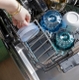 Designed to hold items at the perfect position for washing and drying, the CAFÉ CustomFit Stainless Steel Interior Smart Dishwasher with Ultra Wash includes a lid caddy.