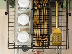 A customizable top rack and basket within the CAFÉ CustomFit Stainless Steel Interior Smart Dishwasher.