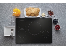 At the touch of a button, multiple burners on the GE Profile Induction Cooktop can turn into an expanded cooking surface – perfect for pancakes. At the touch of a button, multiple burners on the GE Profile Induction Cooktop can turn into an expanded cooking surface – perfect for pancakes.