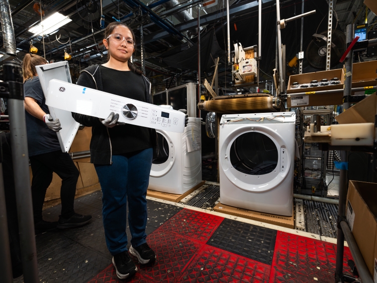 GE Appliances production team member Nydalyn Hazelip prepares to assemble a plastic control panel that forms the consumer-facing interface for GE Appliances’ front-load laundry lineup. This U.S.-made component will be produced by Jones Plastic & Engineering Corp., based in Kentucky and Tennessee, as laundry manufacturing expands at Appliance Park’s Building 2. GE Appliances production team member Nydalyn Hazelip prepares to assemble a plastic control panel that forms the consumer-facing interface for GE Appliances’ front-load laundry lineup. This U.S.-made component will be produced by Jones Plastic & Engineering Corp., based in Kentucky and Tennessee, as laundry manufacturing expands at Appliance Park’s Building 2.