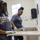 GE Appliances employees measuring and leveling countertops during Hunger Action Month.