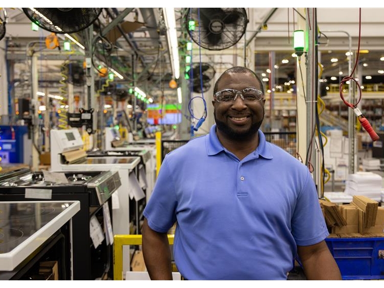 Executive Director and Plant Manager at Roper Corporation, a wholly owned subsidiary of GE Appliances in LaFayette, GA, stands next to one of two new high-volume range manufacturing lines that can produce electric, gas or the new, more affordable induction ranges the company launched this year. Executive Director and Plant Manager at Roper Corporation, a wholly owned subsidiary of GE Appliances in LaFayette, GA, stands next to one of two new high-volume range manufacturing lines that can produce electric, gas or the new, more affordable induction ranges the company launched this year.