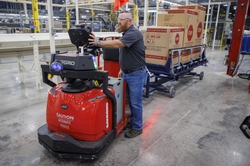 One new job created is the robot wrangler held by Scott Samples.