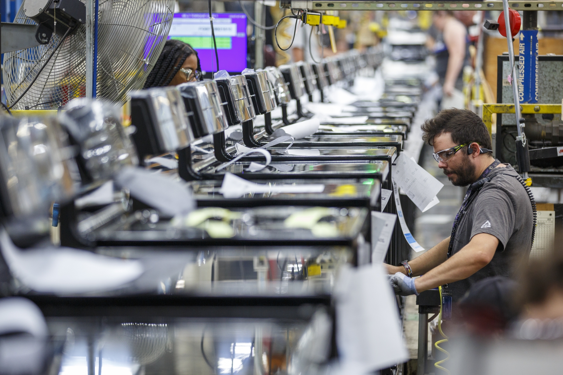 Roper employee Micheal Smith works on a manufacturing line at plant in LaFayette GA