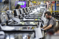 Roper employee Micheal Smith works on a manufacturing line at plant in LaFayette GA