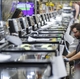 Roper employee Micheal Smith works on a manufacturing line at plant in LaFayette GA