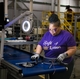 Operator Kim Fleming builds a burner assembly for the new water heaters being made by GE Appliances in Camden South Carolina.