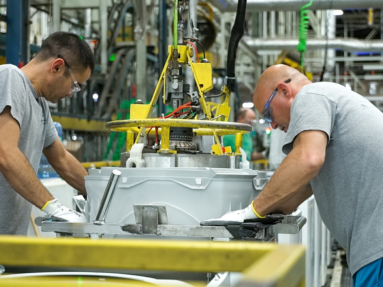 Team members at our AP1 Laundry Plant work together to assemble washing machines.