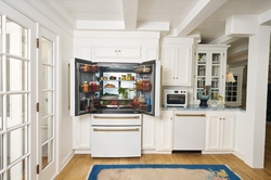 CAFÉ's 4-Door French-Door Refrigerator with Dual Dispense AutoFill Pitcher next to Kates CAFÉ Couture Toaster Oven with Air Fry and CAFÉ CustomFit Dishwasher