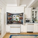  CAFÉ's 4-Door French-Door Refrigerator with Dual Dispense AutoFill Pitcher next to Kates CAFÉ Couture Toaster Oven with Air Fry and CAFÉ CustomFit Dishwasher