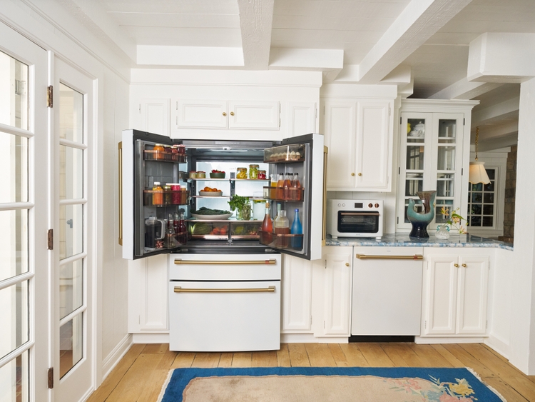  CAFÉ's 4-Door French-Door Refrigerator with Dual Dispense AutoFill Pitcher next to Kates CAFÉ Couture Toaster Oven with Air Fry and CAFÉ CustomFit Dishwasher
