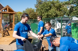 GE Appliances employees work together to strengthen community resources showcasing GE Appliances  belief in zero distance to neighbors and shared impact.
