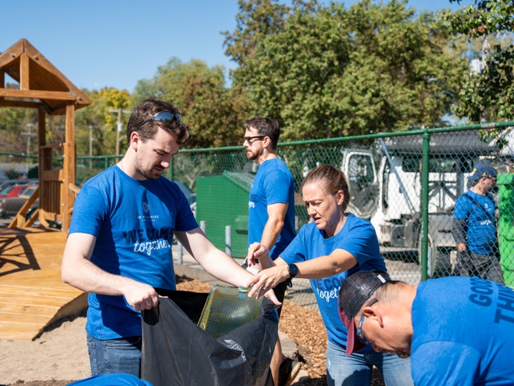 GE Appliances employees work together to strengthen community resources showcasing GE Appliances  belief in zero distance to neighbors and shared impact.