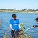 Volunteers clean up the banks of the Ohio River by removing trash and cleaning shared spaces.