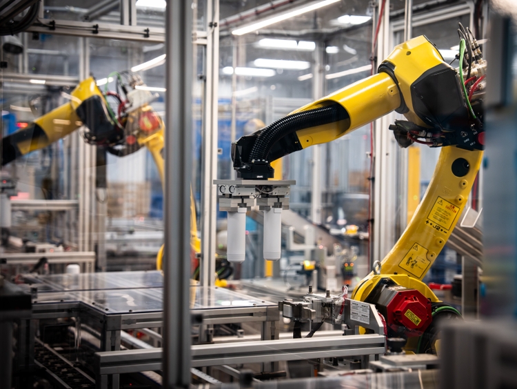 Multiple robotic arms synchronize on the water filter line at Appliance Park in Louisville KY.The new manufacturing operation is GE Applian