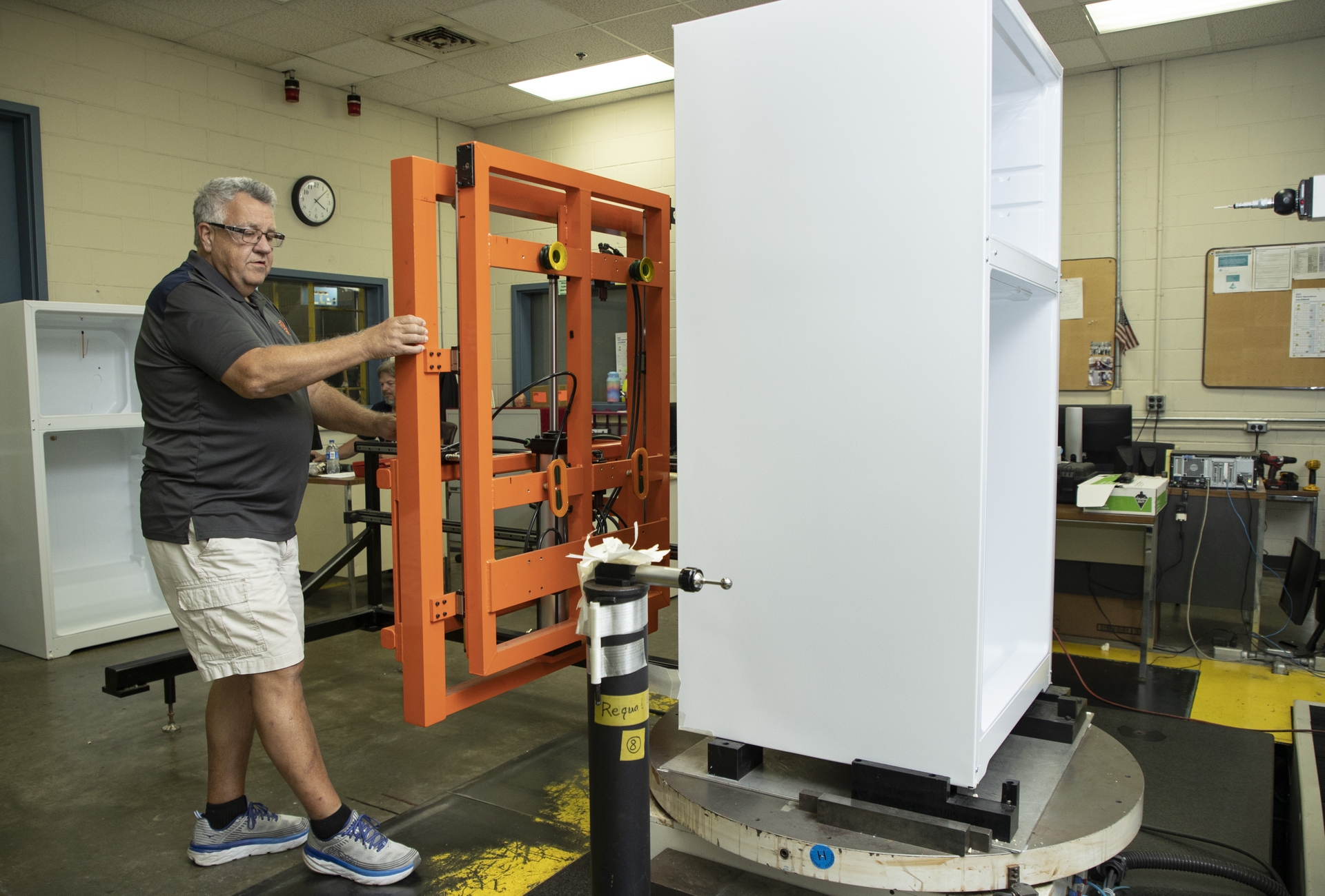 Mike Seal senior quality analyst completes a quality inspection on a GE Appliances refrigerator inside the newly upgraded Decatur Production Operation DPO in Alabama.