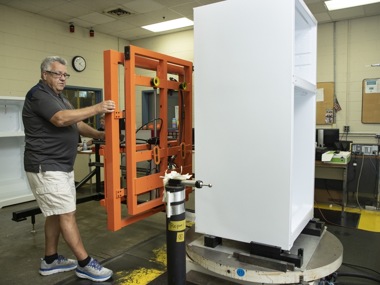 Mike Seal senior quality analyst completes a quality inspection on a GE Appliances refrigerator inside the newly upgraded Decatur Production Operation DPO in Alabama.