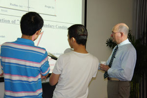 Edl Schamiloglu working with students at Tsinghua University